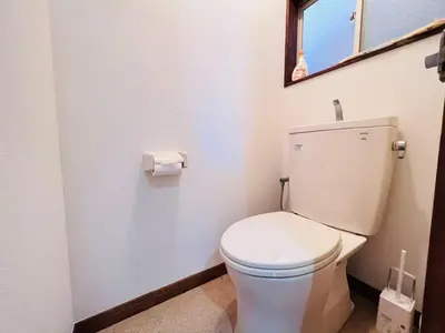 a white toilet in a bathroom with a window at NN-Ōjihonchō-House-KI0174 in Tokyo