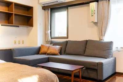 a living room with a couch and a table at Villa mitamura301VM31 in Tokyo