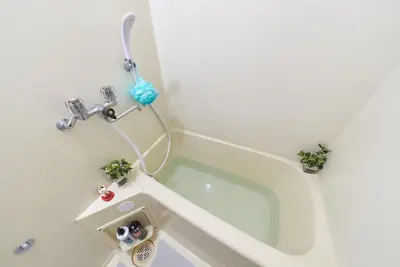a bathroom with a bath tub with a toilet at Belmont 303 3min to Station Easy Access Ueno Asakusa Skytree Sleeps 4 in Tokyo