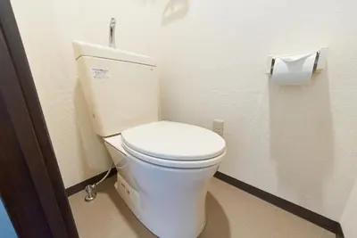 a white toilet in a bathroom with a roll of toilet paper at Belmont 303 3min to Station Easy Access Ueno Asakusa Skytree Sleeps 4 in Tokyo