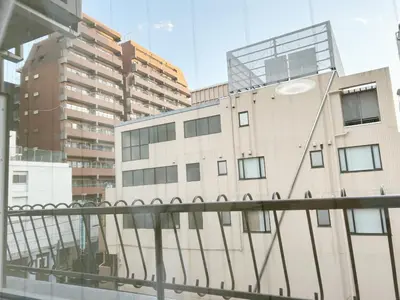 a view of a building from a balcony at \u65b0\u5bbf\u4e2d\u5fc3#\u6b4c\u821e\u4f0e#Shinjuku 3min walk#\u5730\u94c1\u7ad9\u6b65\u884c3\u5206#JR\u65b0\u5bbf\u7ad9\u6b65\u884c9\u5206\u949f#\u97e9\u56fd\u57ce#\u9ad8\u901f\u65e0\u9650\u5236\u7f51\u8def#\u81ea\u52a8Autolock\u5927\u95e8411 in Tokyo