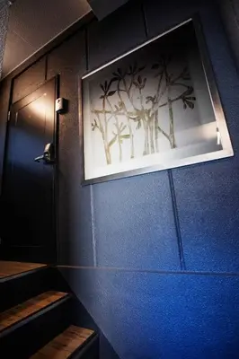 a blue wall with a picture of trees on it at Harebare apartment for max 3ppl 3mins walk from Kiba station 2F in Tokyo