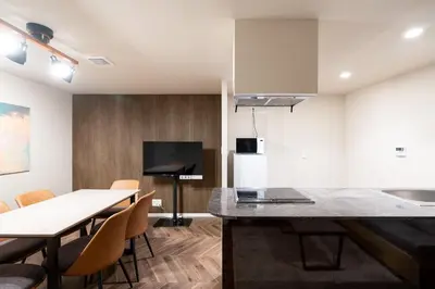 a kitchen and dining room with a table and chairs at Apartment\u5c0f\u77f3\u5ddd\u5f8c\u697d\u5712 in Tokyo