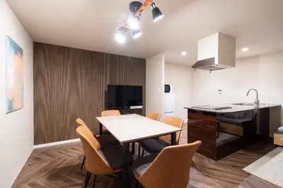 a kitchen and dining room with a table and chairs at Apartment\u5c0f\u77f3\u5ddd\u5f8c\u697d\u5712 in Tokyo