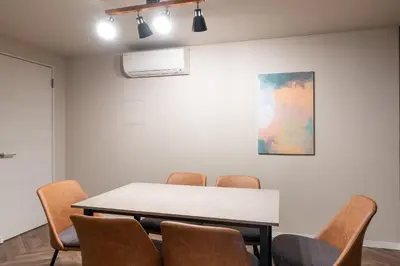 a meeting room with a table and chairs at Apartment\u5c0f\u77f3\u5ddd\u5f8c\u697d\u5712 in Tokyo