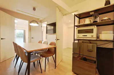 a kitchen and dining room with a table and a microwave at V Close to Shinjuku Kabukicho Korean Town FrWIFI I in Tokyo