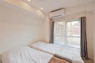 a small bedroom with a bed and a window at V Close to Shinjuku Kabukicho Korean Town FrWIFI I in Tokyo