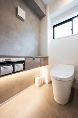 a bathroom with a white toilet and a window at WABI & GIVE Nakano Araiyakushi in Tokyo
