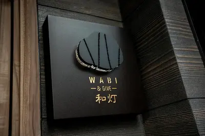 a picture of a necklace on a wall at WABI & GIVE Nakano Araiyakushi in Tokyo