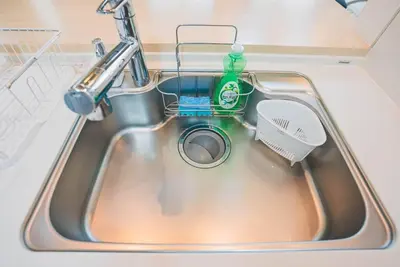 a sink with a dish brush and a bottle of detergent at New! U&I Villa close Disney & Narita AP - Great View in Tokyo