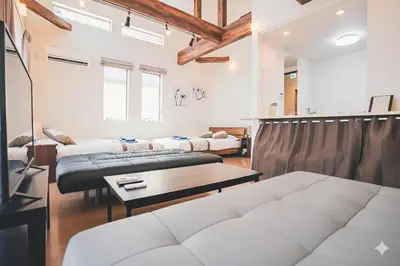 a living room with two beds and a couch at New! U&I Villa close Disney & Narita AP - Great View in Tokyo