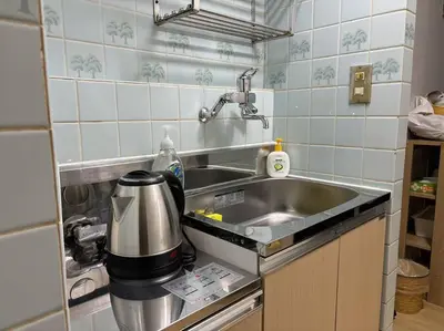 a kitchen counter with a sink and a mixer at Nakano 102 Walking 4 Mins Broadway Shinjuku 1 stop in Tokyo