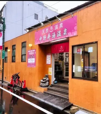 a building with a bike parked in front of it at Nakano 103 Walking 4 Mins Broadway Shinjuku 1 stop in Tokyo