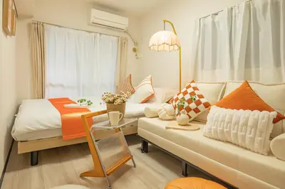 a living room with a couch and a table at Nakano101,Nakano Broadway,Shinjuku 1 stop in Tokyo