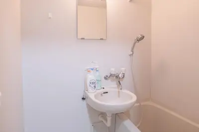 a bathroom with a sink and a shower at Nakano101,Nakano Broadway,Shinjuku 1 stop in Tokyo