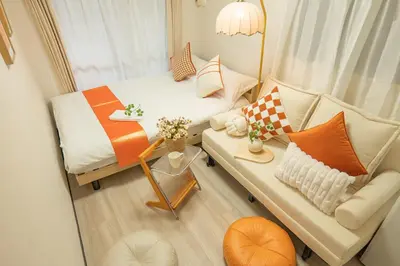 a small living room with a couch and a table at Nakano101,Nakano Broadway,Shinjuku 1 stop in Tokyo