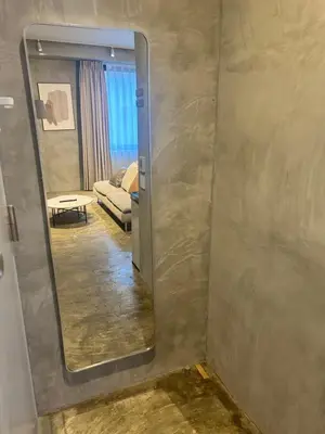 a mirror in a room with a living room at Spacious Tokyo Base near Tamachi station Hotel Ten Tamachi in Tokyo