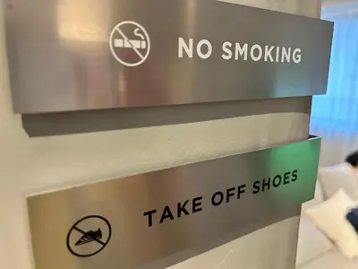 a sign that says no smoking take off shoes at Spacious Tokyo Base near Tamachi station Hotel Ten Tamachi in Tokyo