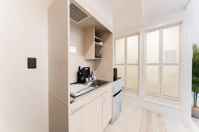 a kitchen with white cabinets and a sink at #1 -\u9ad8\u7530\u99ac\u5834\u30a2\u30cd\u30c3\u30af\u30b9- Condo in Tokyo