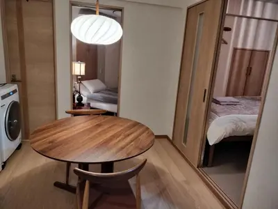 a small room with a table and a bed at \u6e90\u6c0f\u6c11\u5bbf in Tokyo