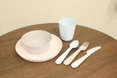 a table with a cup and a plate and fork and knife at \u30aa\u30b0\u30e9\u30d3\u30eb 205 in Tokyo