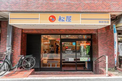 a bike parked in front of a store at Kiwami Hotel Shinjuku in Tokyo