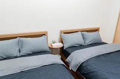 two beds sitting next to each other in a bedroom at Mio Hotel Shinjuku Tokyo in Tokyo