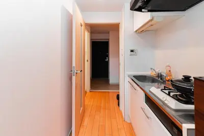 a kitchen with a sink and a stove at Mio Hotel Shinjuku Tokyo in Tokyo
