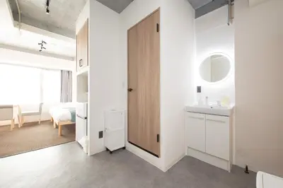 a bathroom with a door leading to a bedroom at Blossom House Akasaka301 in Tokyo