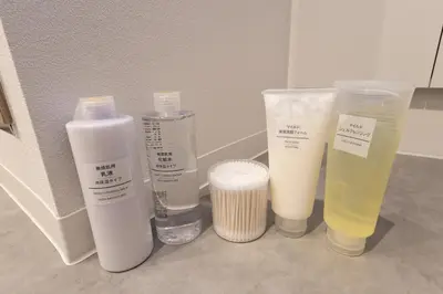 a group of bottles of moisturizing products sitting on a counter at Blossom House Akasaka301 in Tokyo