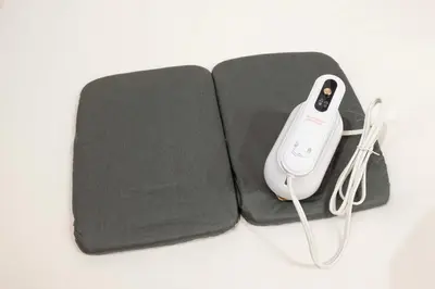 a remote control sitting on top of a black case at Blossom House Akasaka301 in Tokyo