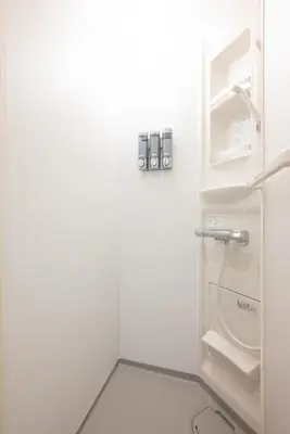 a small white refrigerator with its door open at Blossom House Akasaka301 in Tokyo