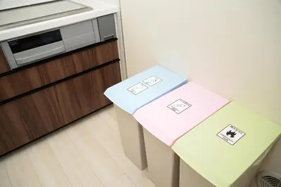 two boxes sitting on top of a table in a kitchen at NYHotel 1 \u65b0\u5bbf2\u968e\u5efa\u30664\u5ba41\u30d0\u30b9\u30eb\u30fc\u30e01\u30b7\u30e3\u30ef\u30fc2\u30c8\u30a4\u30ec in Tokyo