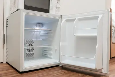 a white refrigerator with its door open in a kitchen at \u6771\u4eac\u30ea\u30ea\u30a2\u30eb\u30db\u30c6\u30eb0501 in Tokyo