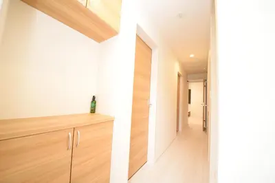 a hallway of a house with white walls and wood floors at NYHotel 2 \u65b0\u5bbf2\u968e\u5efa\u30663\u5ba41\u30d0\u30b9\u30eb\u30fc\u30e01\u30b7\u30e3\u30ef\u30fc2\u30c8\u30a4\u30ec in Tokyo
