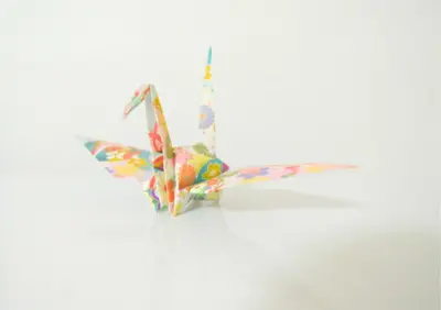 a origami butterfly ornament on a white background at Rooftop Haven \u65b0\u5c0f\u5ca9 in Tokyo