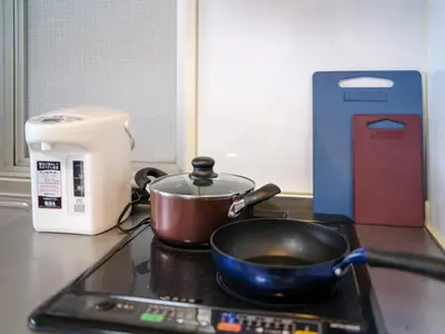 a frying pan on a stove top in a kitchen at Tokyo Stay Akasaka in Tokyo
