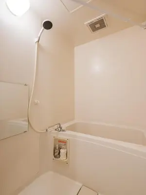 a white bathroom with a shower and a toilet at Tokyo Stay Akasaka in Tokyo