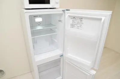 a white refrigerator with its door open in a kitchen at NYHotel 3 \u65b0\u5bbf2\u968e\u5efa\u30663\u5ba41\u30d0\u30b9\u30eb\u30fc\u30e01\u30b7\u30e3\u30ef\u30fc2\u30c8\u30a4\u30ec in Tokyo