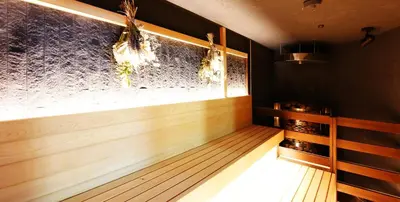 a wine tasting room with a window and wooden floors at Capsule Inn Otsuka in Tokyo