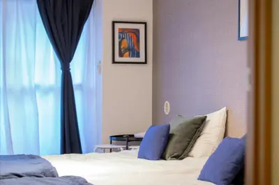a bedroom with a bed and a window at Sumida River 'Midori' APT in Tokyo