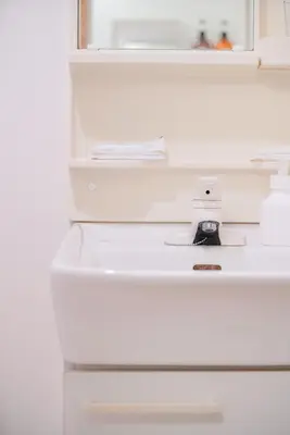 a white refrigerator with a white sink in it at Sumida River 'Midori' APT in Tokyo