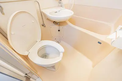 a bathroom with a toilet and a sink on an airplane at \u65b0\u5bbf\u533a\u6b4c\u821e\u4f0e\u753a\u4f0a\u52bf\u4e39\u5f92\u6b653\u5206\u949f#6 in Tokyo