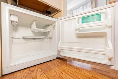 an empty refrigerator with its door open at \u65b0\u5bbf\u533a\u6b4c\u821e\u4f0e\u753a\u4f0a\u52bf\u4e39\u5f92\u6b653\u5206\u949f#6 in Tokyo
