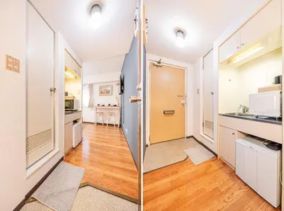 a kitchen with white walls and wooden floors at \u65b0\u5bbf\u533a\u6b4c\u821e\u4f0e\u753a\u4f0a\u52bf\u4e39\u5f92\u6b653\u5206\u949f#6 in Tokyo