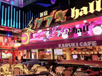 a restaurant with chairs in front of a bar at \u65b0\u5bbf\u533a\u6b4c\u821e\u4f0e\u753a\u4f0a\u52bf\u4e39\u5f92\u6b653\u5206\u949f#6 in Tokyo