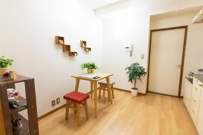 a room with a table and chairs in a room at Minimalism Hotel Sumida 1 in Tokyo