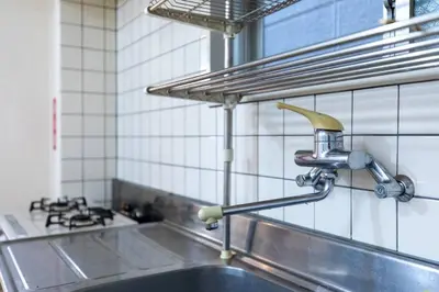 a kitchen with a sink and a faucet at Minimalism Hotel Sumida 1 in Tokyo