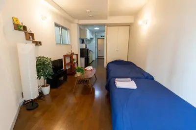 a bedroom with a blue bed in a room at Minimalism Hotel Sumida 2 in Tokyo