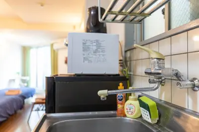 a kitchen counter with a sink and a kitchen at Minimalism Hotel Sumida 2 in Tokyo